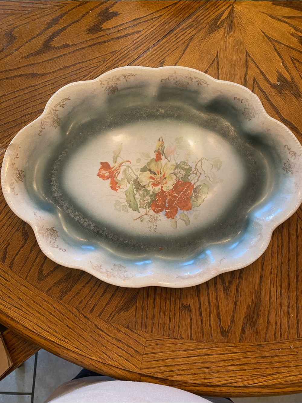 Floral porcelain  oval Serving platter look at pictures it a chip in and back